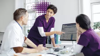 Healthcare Professional looking at Monitor