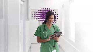 Healthcare Professional looking at Monitor